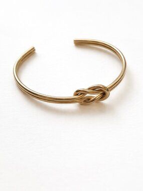 Minimalist Gold tone quiet luxury knotted bracelet